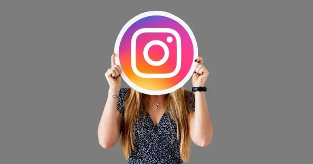 A Female holding Instagram logo